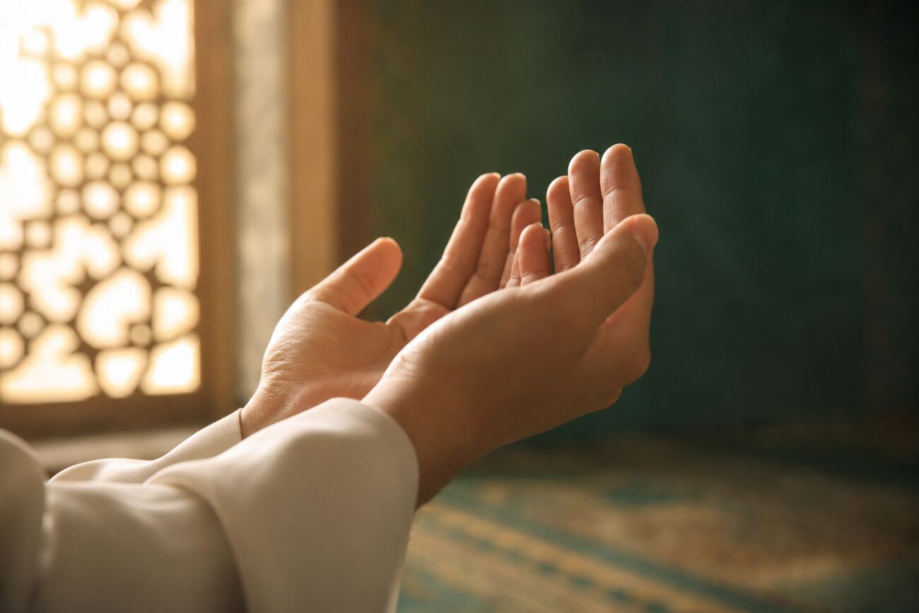 Hands raised in prayer